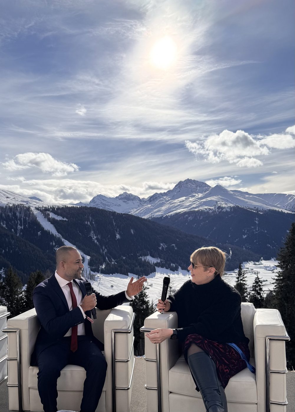 Shameek in conversation on a terrace above Davos