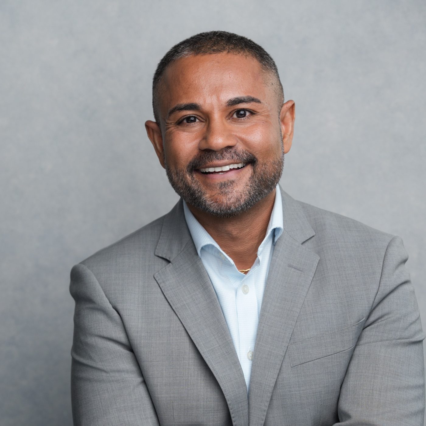 Portrait of Shameek Bose in a gray blazer